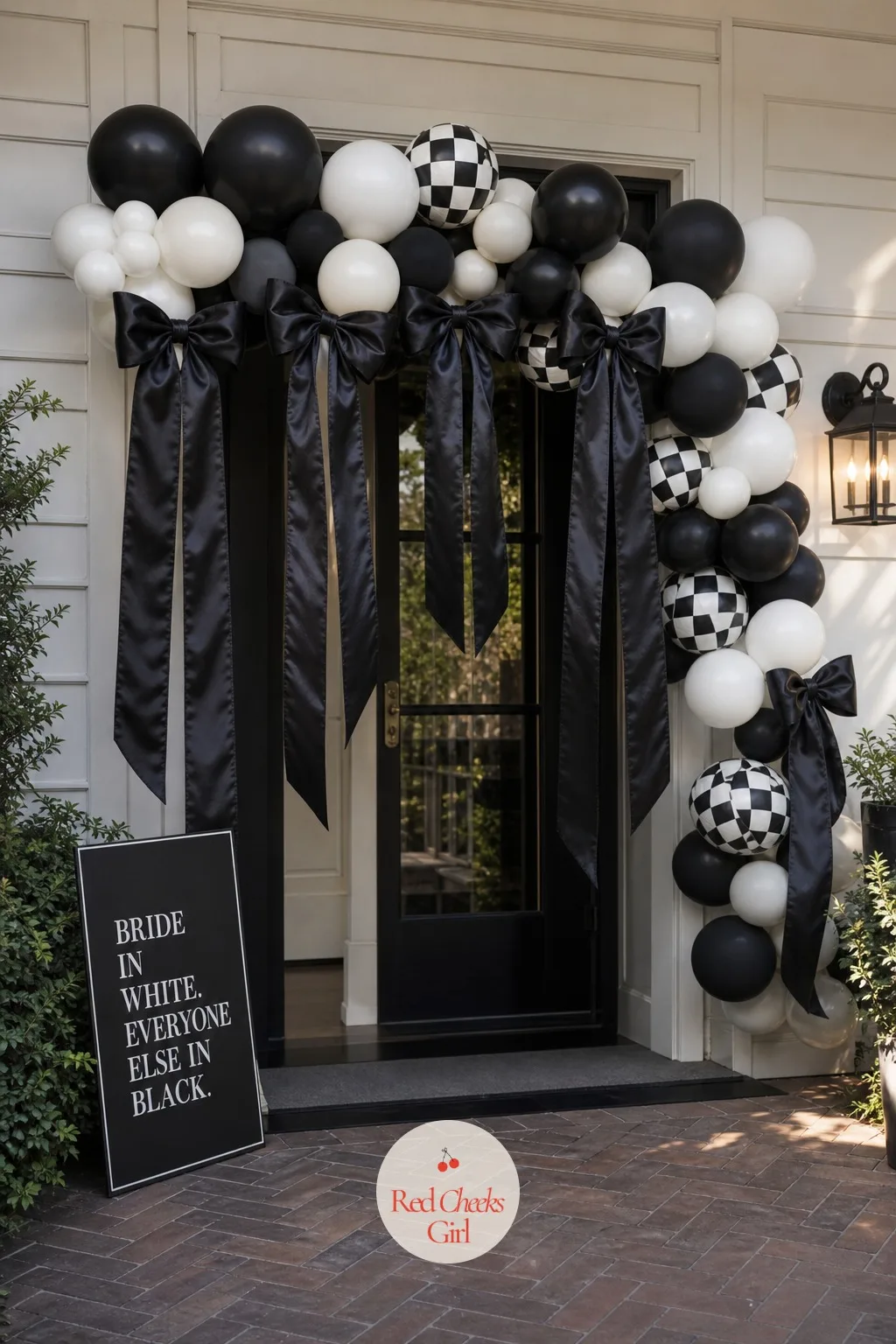 Black Bow Balloon Garland at the Entrance — The first thing guests see should not be a bare front door. Black and white bachelorette party