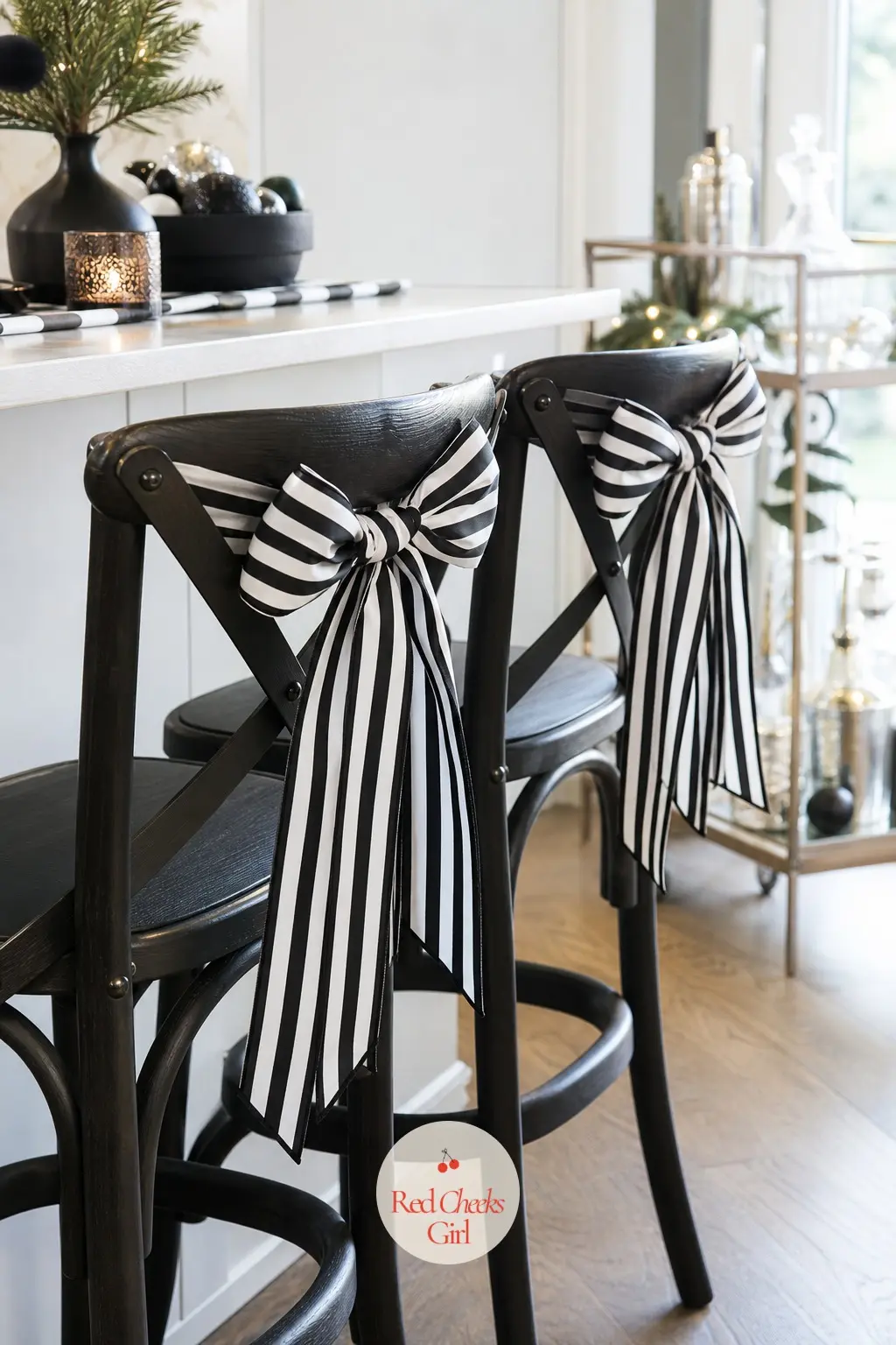 The Bar Stools, Tied With Striped Ribbon Bows — Two plain bar stools get one small bow each, tied to the back rail in the same striped ribbon used on the