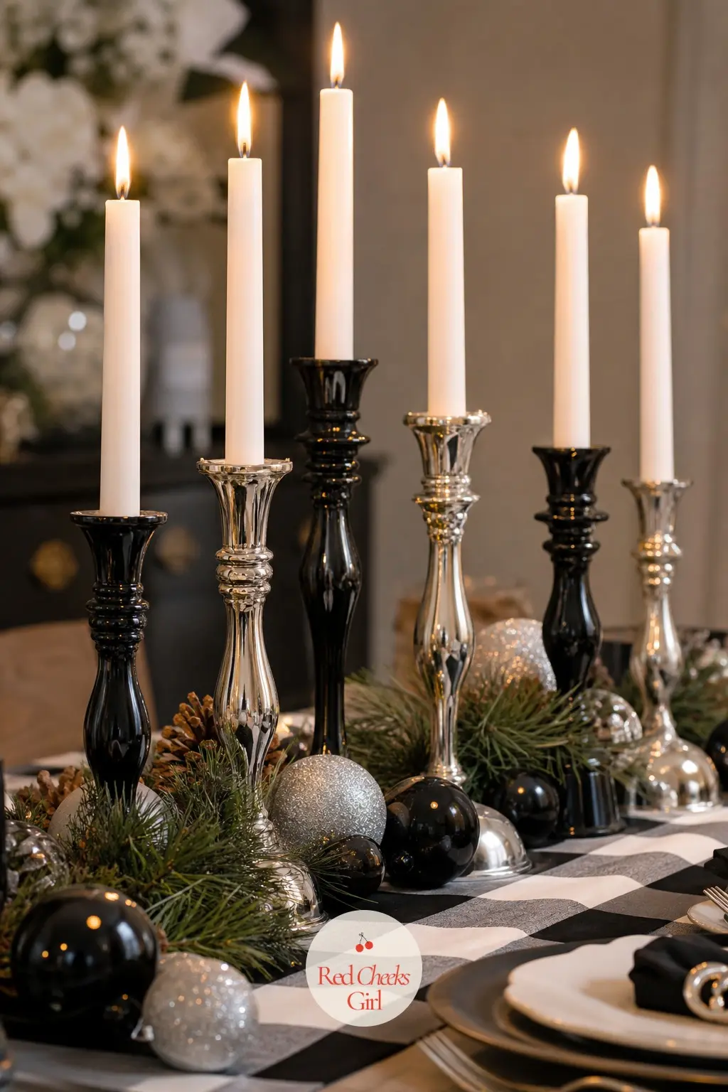 The Candlesticks, Lined Down the Table in Black and Silver — A row of candlesticks alternating black and silver down the centre of the table does more for the