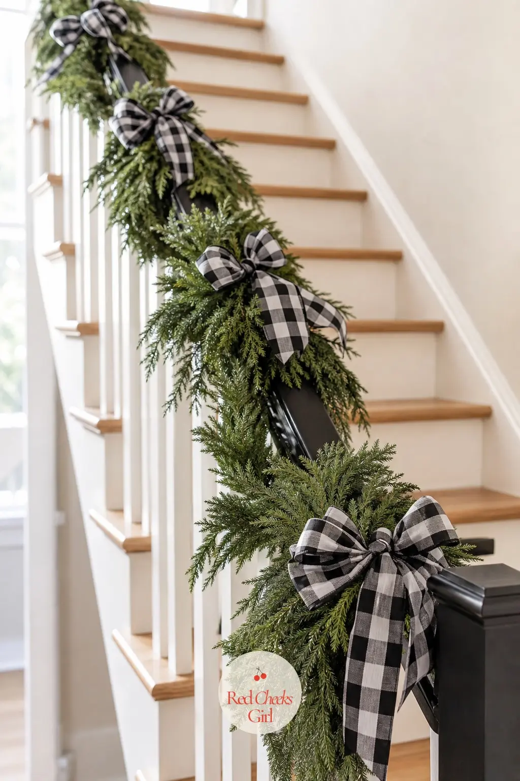 The Staircase, Wrapped in Garland for the Banister — The staircase gives the eye one long continuous line, so the garland here runs the whole banister in a