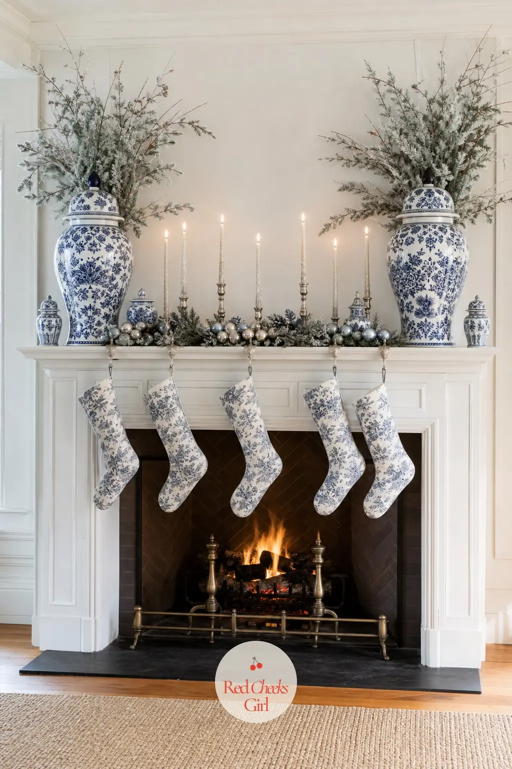 The Mantel, Lined With Chinoiserie Urns and Icicle Candles — A pair of blue-and-white urns anchors each end of the shelf, filled with frosted branches, with