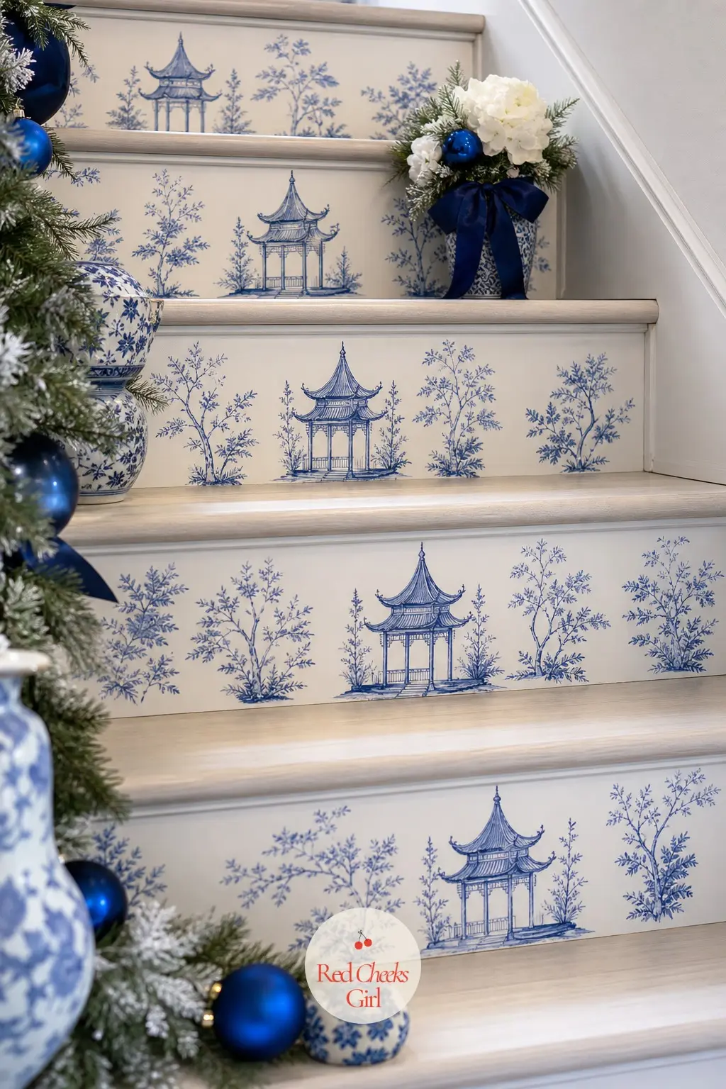 The Stair Risers, Stenciled in a Chinoiserie Motif — Each riser carries a small blue-and-white pagoda pattern, applied as a removable decal rather than paint