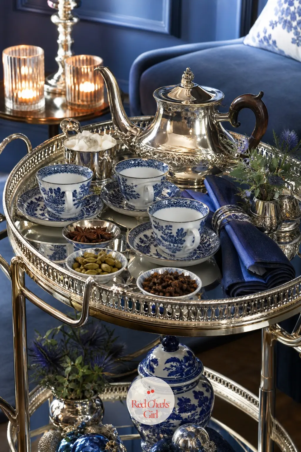 The Tea Trolley, Poured in Blue and Silver — A trolley in the corner holds a large silver teapot, rows of blue-and-white cups, and small bowls of star anise