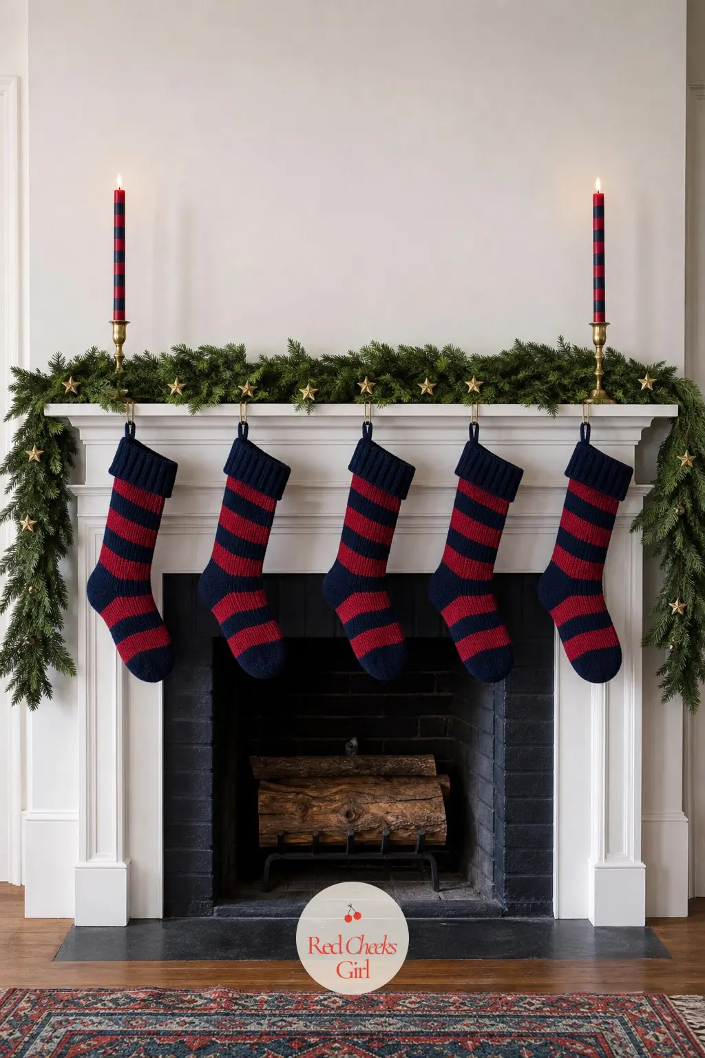 The Mantel, Hung With 5 Striped Stockings and a Brass Garland — Five knit stockings in alternating navy and cherry stripe hang from brass hooks along the
