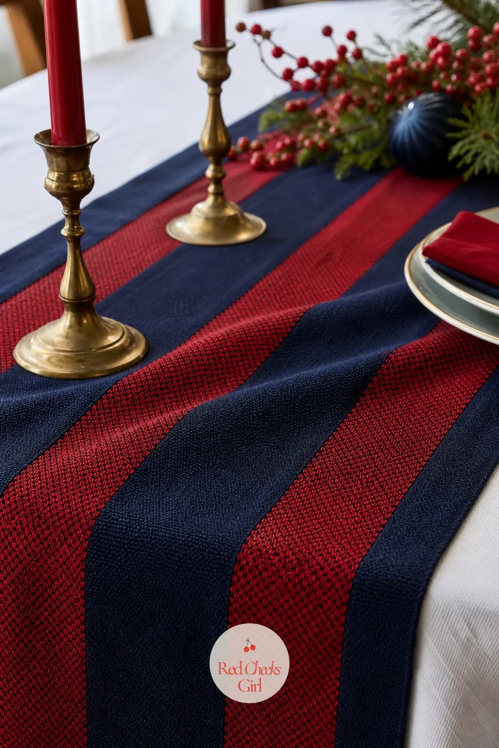 The Table Runner, Laid in Bold Navy and Cherry Stripes — A woven runner in bold navy and cherry stripe runs the full length of the table over a plain white
