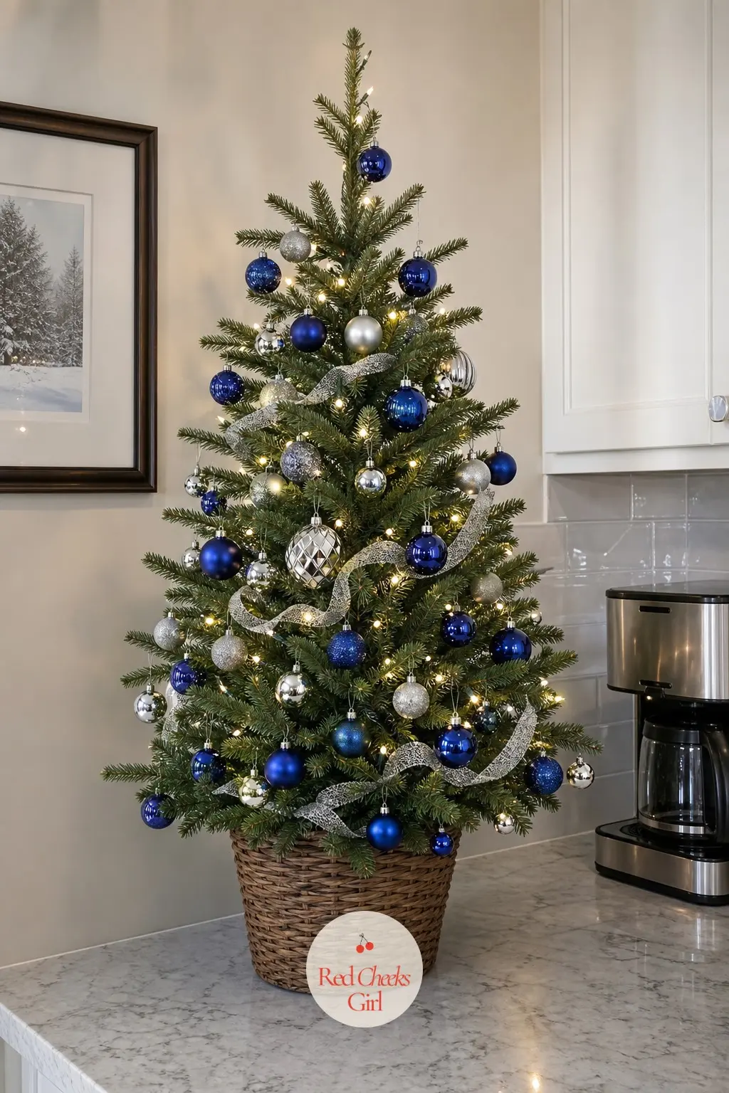 A Cobalt Tabletop Tree by the Coffee Maker — A small, real potted tree sitting on the kitchen counter next to the coffee maker, decorated entirely in miniature