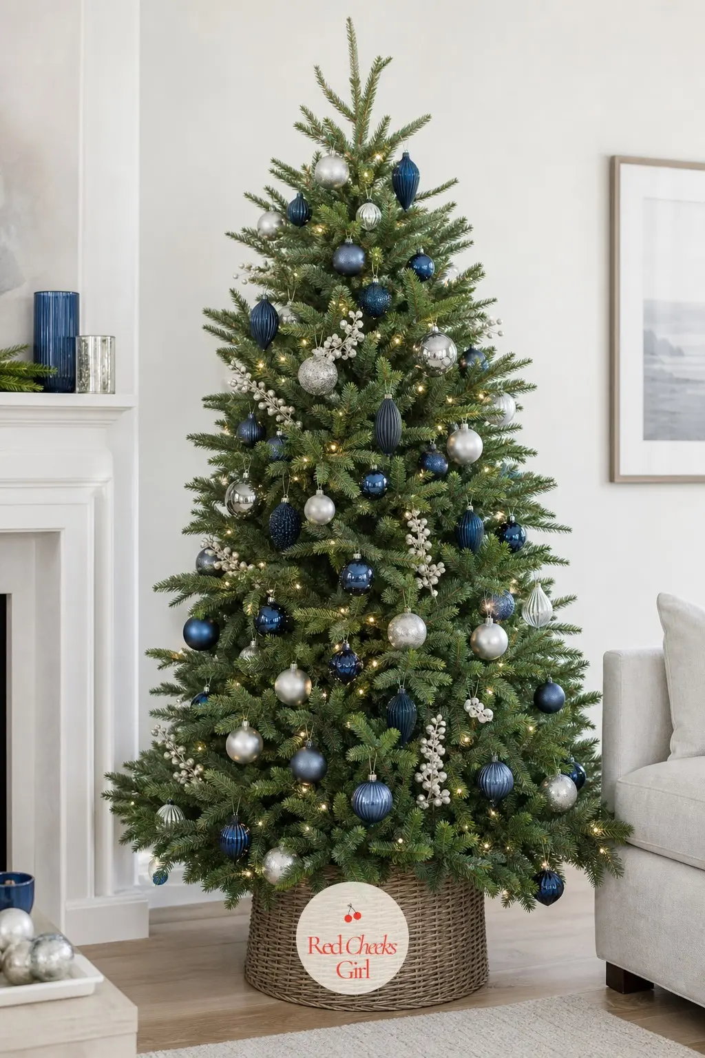 A Floor to Ceiling Classic Blue and Silver Statement — A real, full tall tree standing floor to ceiling in a bright white living room with pale oak floors and