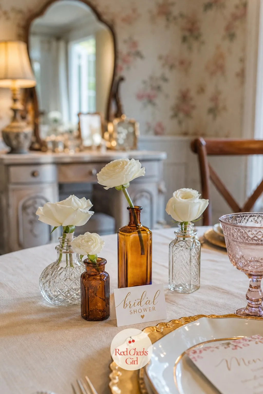 Vintage Perfume Bottles as Tiny Bud Vases — Not every table needs a centerpiece in the exact center. Bridal shower centerpieces