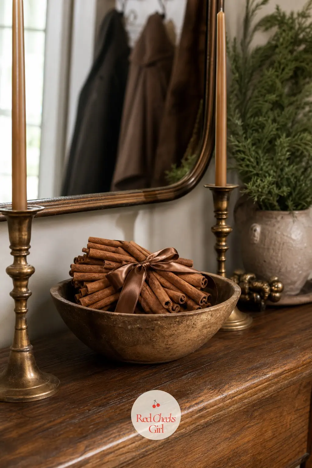 The Entryway Console, Set with a Bowl of Cinnamon Sticks and Bronze Candlesticks — The console by the front door carries the palette into the first thing a
