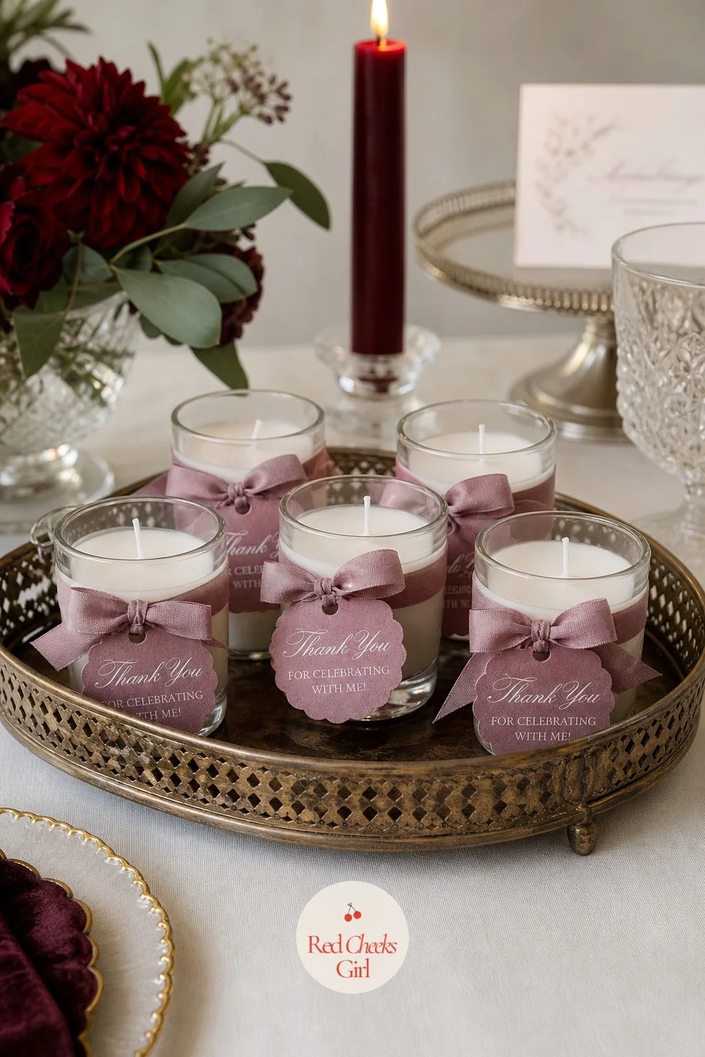 Glass Votive Candle Favours — A small glass votive tied with a mauve ribbon costs little, weighs nothing in a handbag, and gets used the week after the party