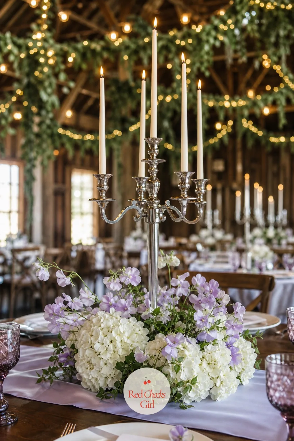 Low Florals at the Base with Tall Candles — Nothing sits on the arms at all here, just bare candlelight rising out of a low ring of hydrangea and sweet pea