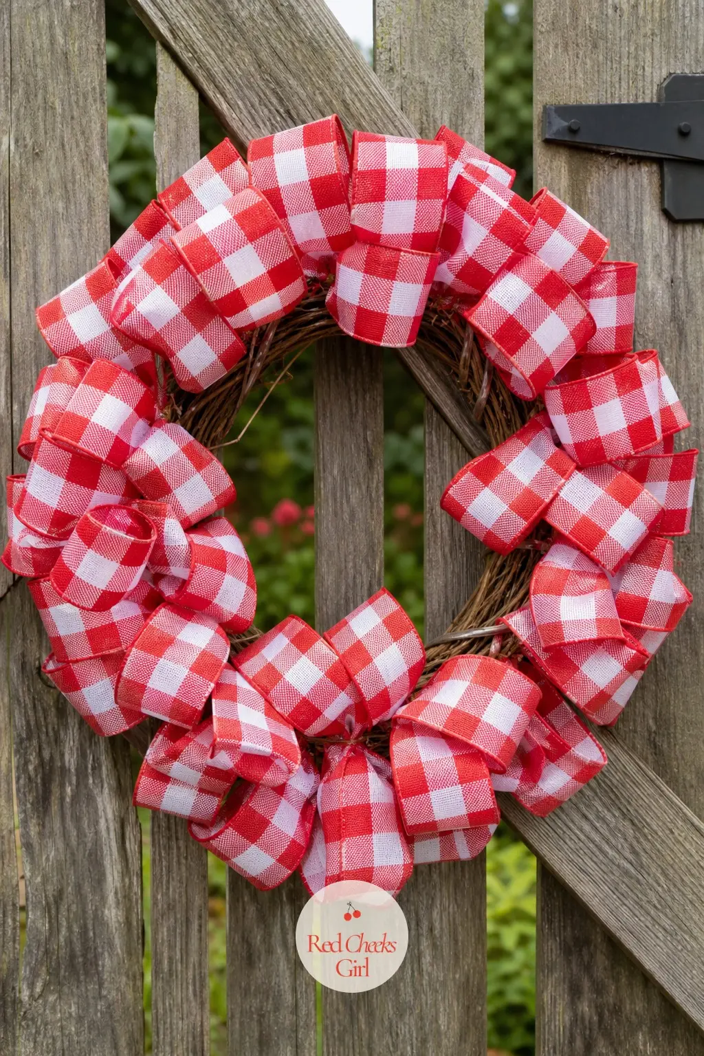 A Red and White Check Ribbon Wreath for the Garden Gate — Thick red and white buffalo check ribbon loops stand proud of a grapevine base rather than lying