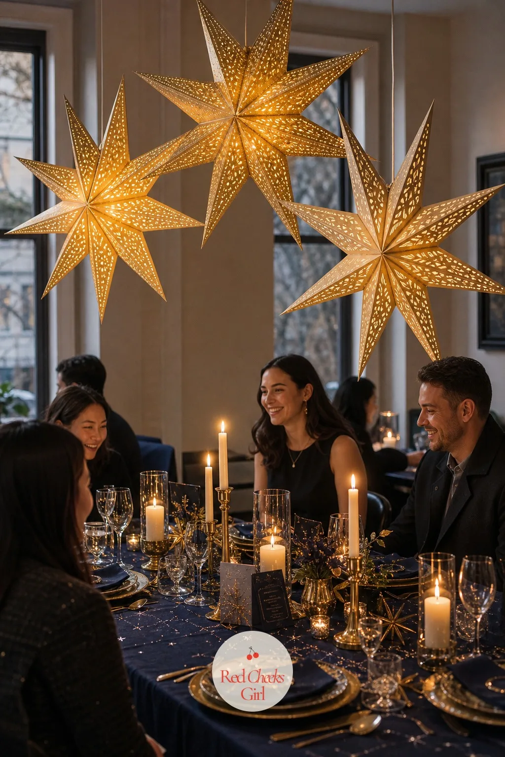 The Giant Paper Star Lanterns Over the Table — A dining table under a plain pendant light looks like dinner on any other Tuesday, which is exactly the problem