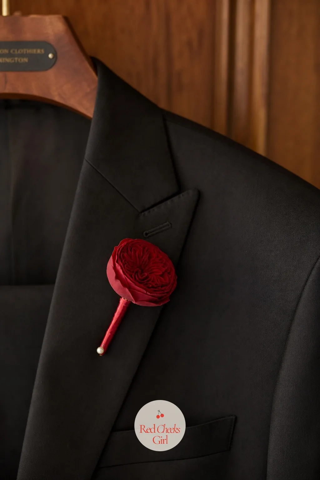 Boutonnieres With A Real Cherry Tucked In — A standard rose boutonniere can look a little expected on a day this specific. Cherry red wedding