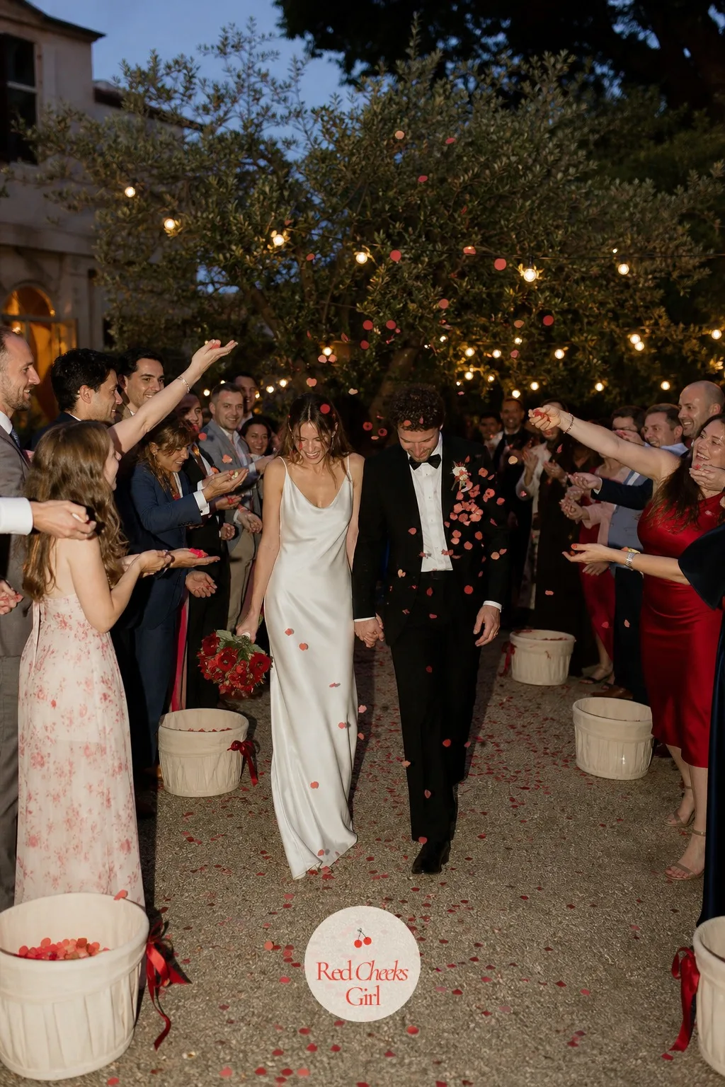 A Cherry Confetti Send-Off — Real fruit looks perfect on a table and far less perfect thrown at a cream gown, so the send-off borrows the shape of a cherry