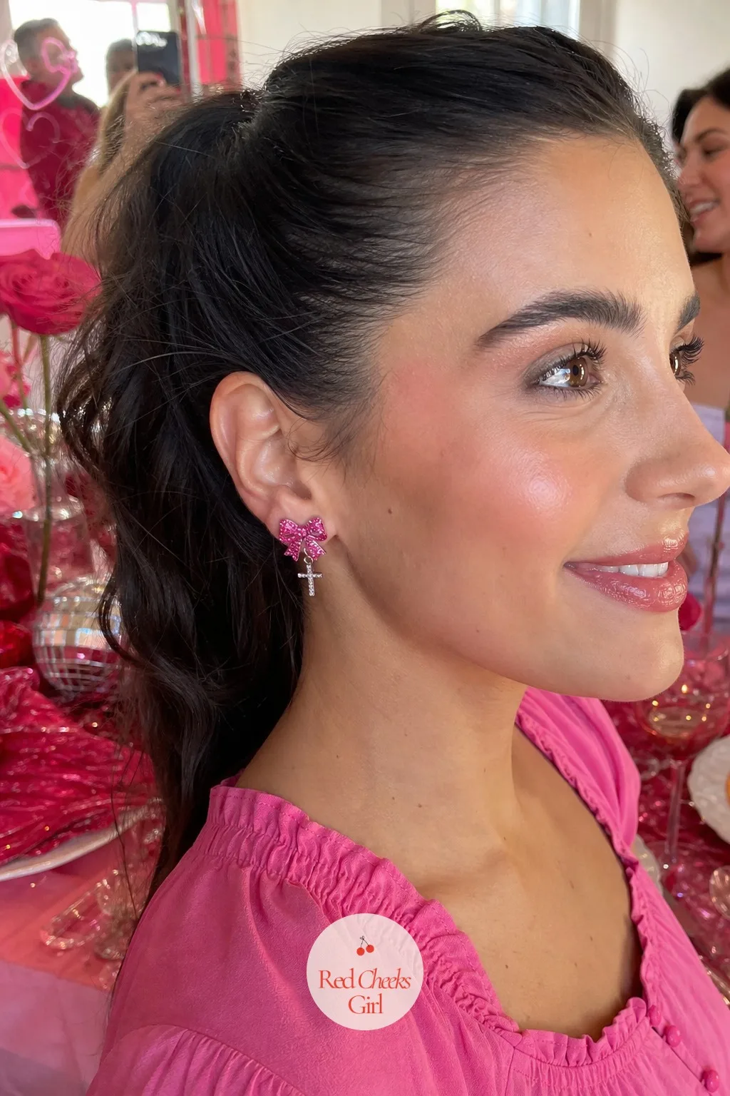 Glitter Bow Stud Earrings With Scripture Charm — These are the earrings a teenager and a grandmother both pick up, because a glitter bow reads young and a tiny