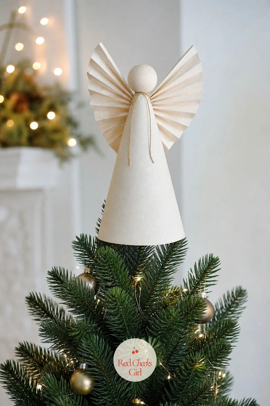 Paper Cone Topper Angel — Most boxed toppers are either too small for a real tree or lit up in a shade of blue nothing else in the room matches. Christmas