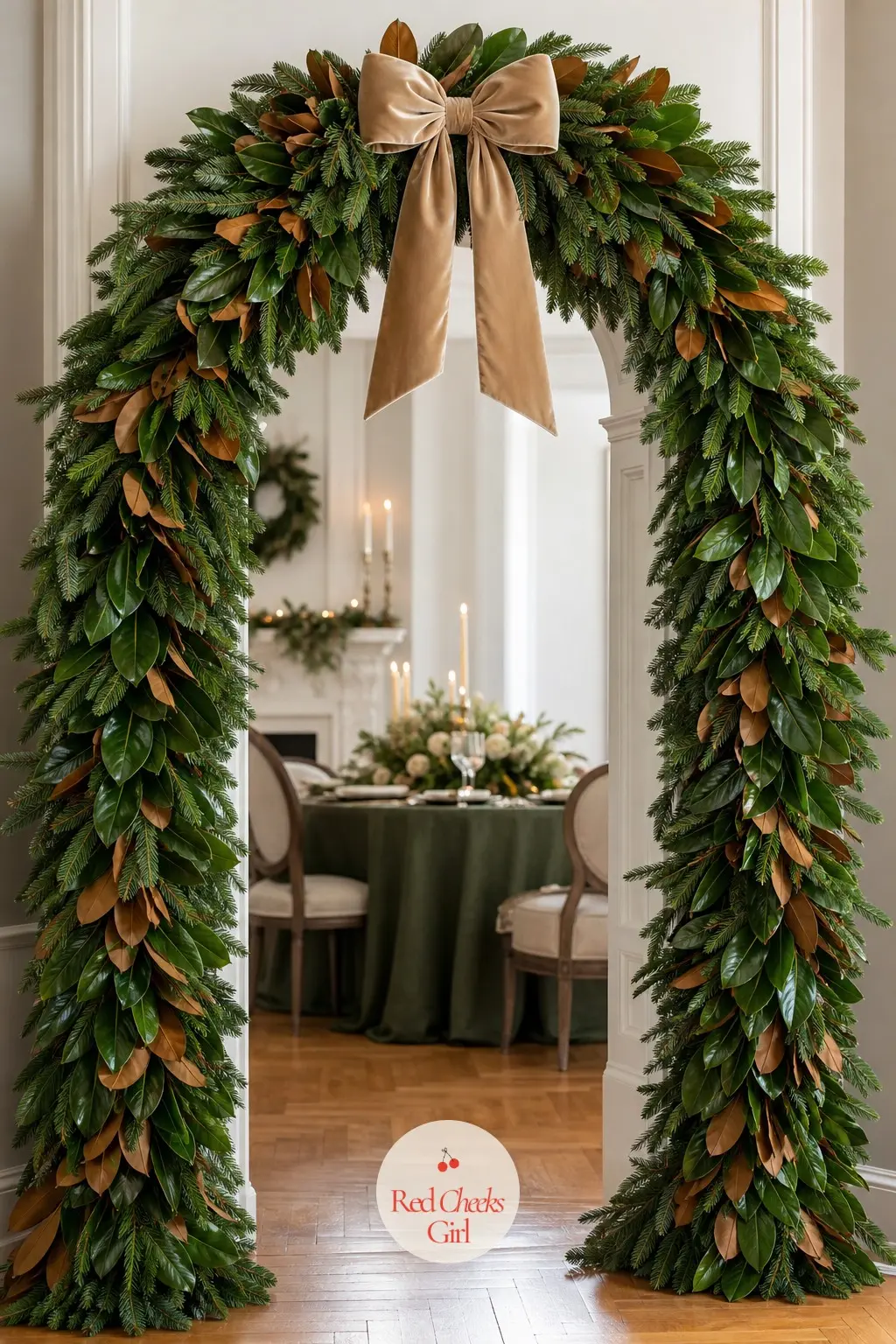 A Noble Fir and Magnolia Leaf Archway with Champagne Velvet Bow — Noble fir holds its needles for weeks indoors, which makes it the safer choice than spruce