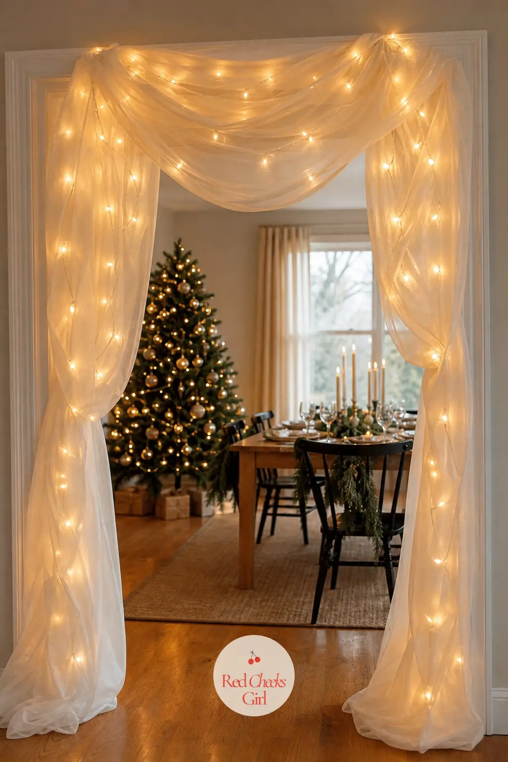 A Warm Fairy Light Canopy Archway Draped in Sheer Ivory Voile — This one skips greenery entirely and lets light be the only material. Christmas archway decor