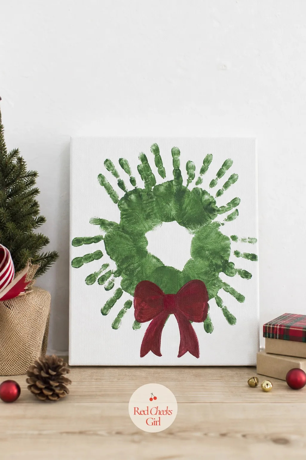 Handprint Wreath Keepsake Canvas — Handprint crafts get dismissed as a toddler thing, but at six to ten the hand is still small enough to matter and still