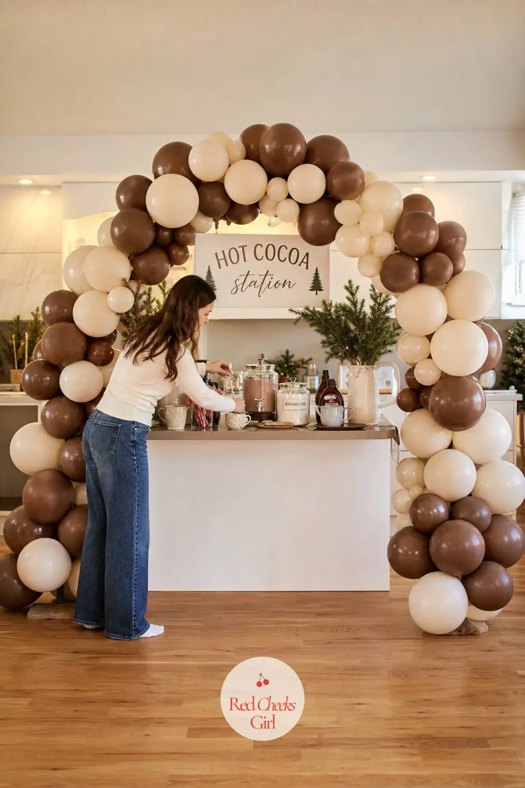 A Cocoa Brown and Cream Balloon Arch Over the Hot Cocoa Station — Matte finishes matter more here than anywhere else on this list: glossy balloons over a cocoa