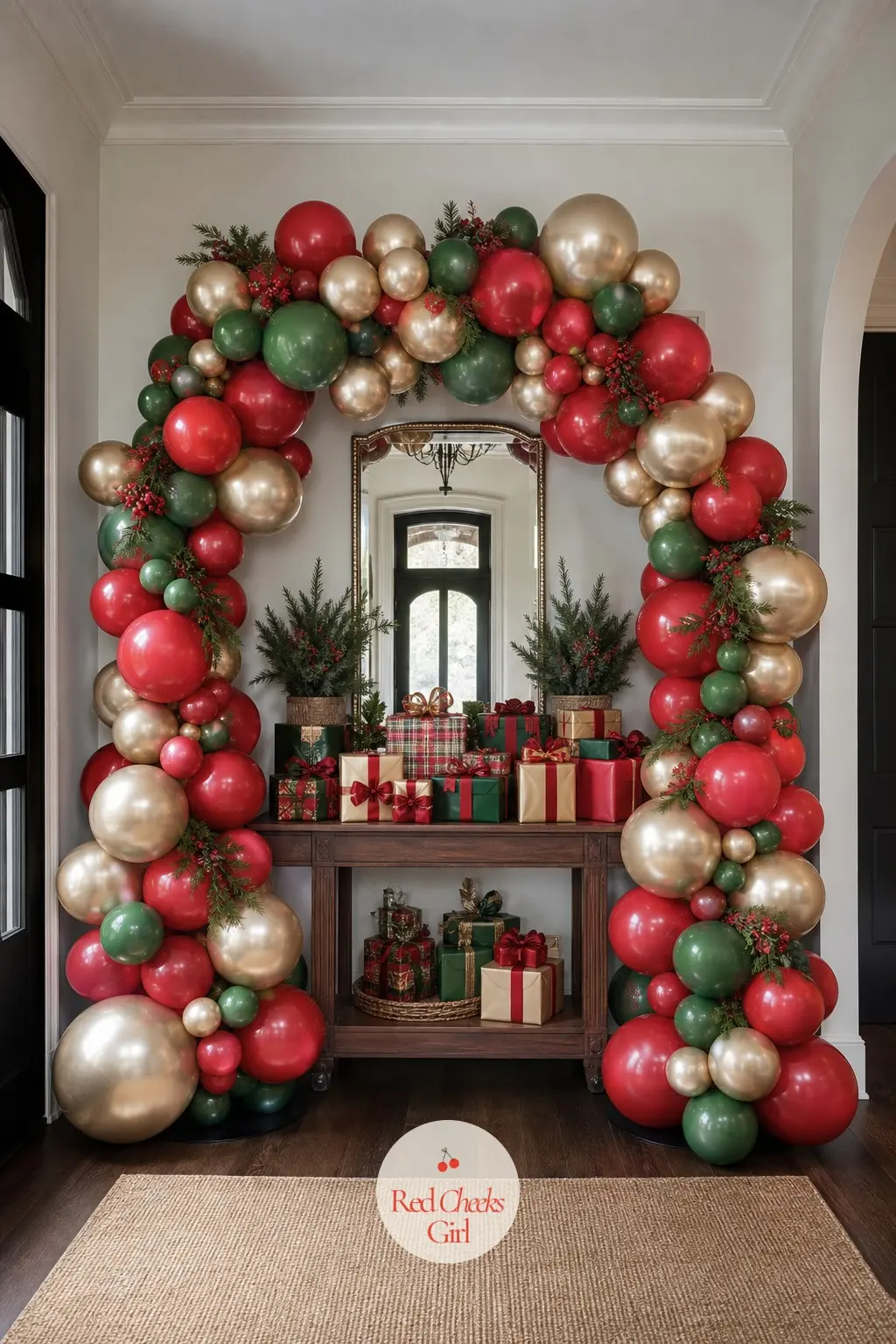 A Holly Red and Champagne Balloon Arch Over the Foyer Gift Table — Guests drop presents here the second they walk in, so this is one of the few spots where an