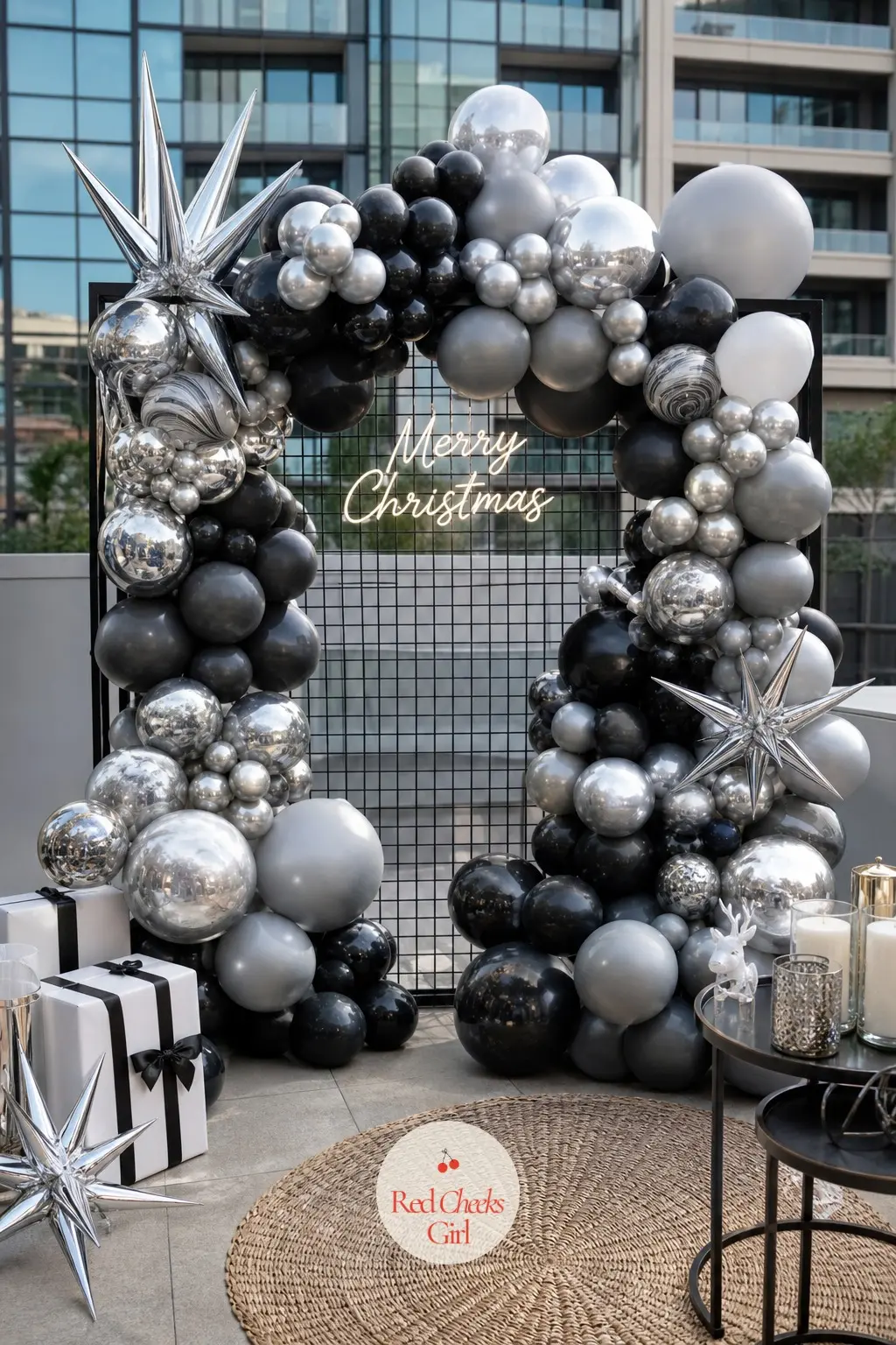 A Chrome Silver and Black Balloon Grid Wall for a Modern City Christmas — Two colours only, chrome silver and matte black, arranged in a precise grid rather