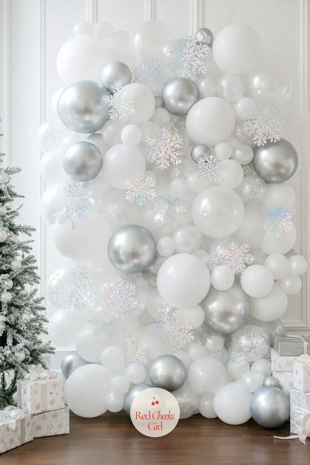 A Frosted White and Silver Organic Balloon Wall With Iridescent Snowflake Confetti — Build this one as a tight, organic cluster wall rather than a grid: white