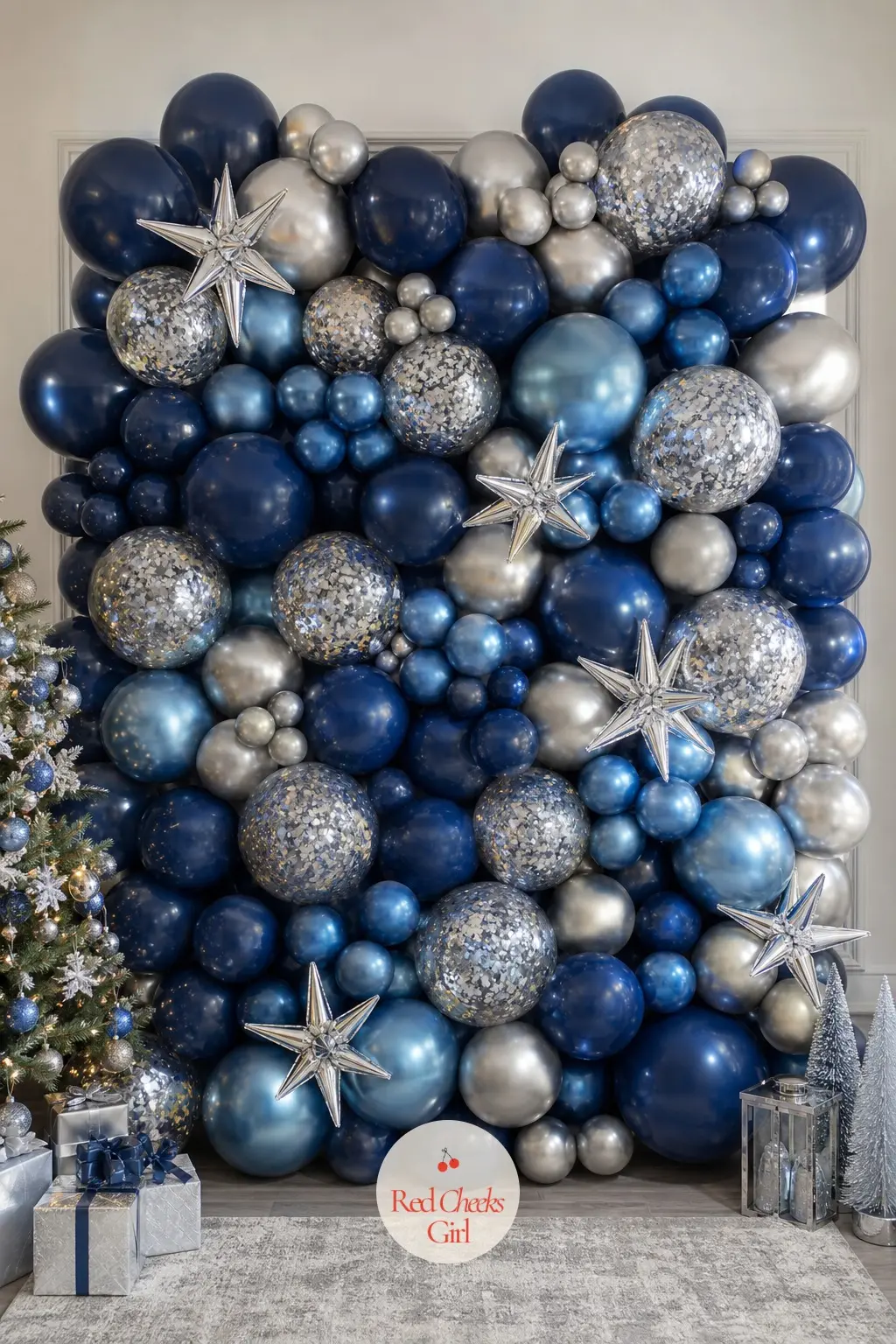 A Sapphire Blue and Silver Balloon Wall With Star Confetti — Sapphire reads colder than emerald or ruby, closer to midnight than to a traditional palette