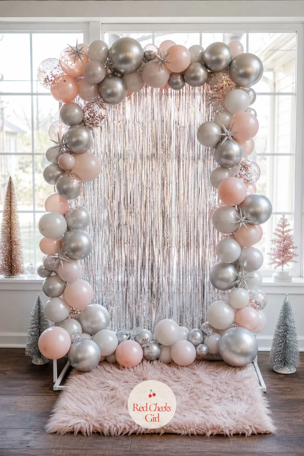 A Tabletop Balloon Backdrop Frame Propped Against a Window for Small Apartments — A small tabletop frame, wrapped in just enough silver and blush balloons to