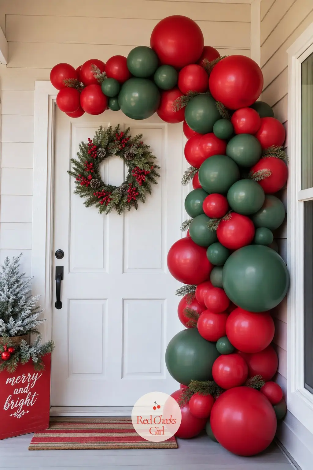 A Two-Tone Balloon Garland Taped Onto a Door for an Instant Photo Spot — No frame, no foam board, just a short red and white garland taped directly across a