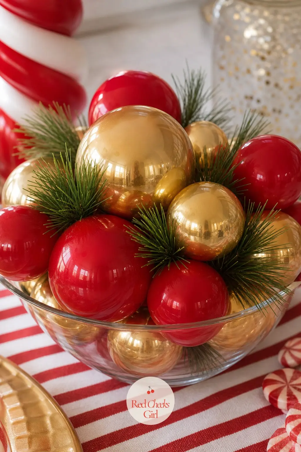 A Balloon Centerpiece of Red and Gold Spheres in a Low Bowl — Small latex balloons in red and gold fill a low glass bowl, their rounded tops just clearing the