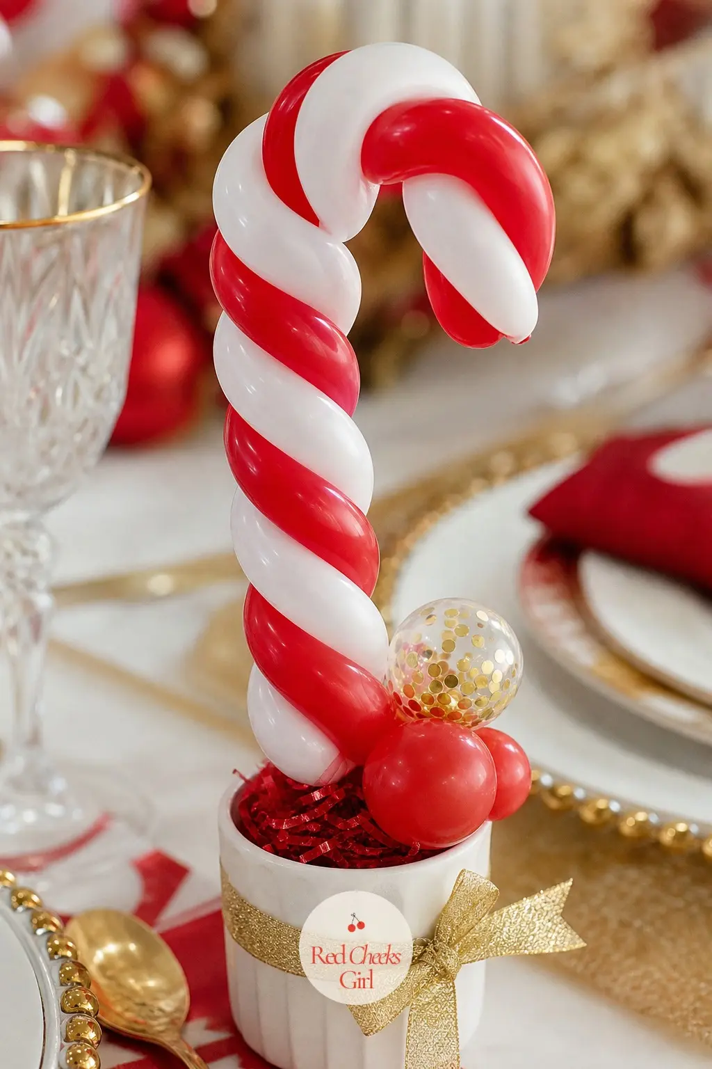 A Mini Candy Cane Balloon Topiary at Each Place Setting — A thin stem of twisted red and white balloon rises from a tiny pot no bigger than a teacup, sitting