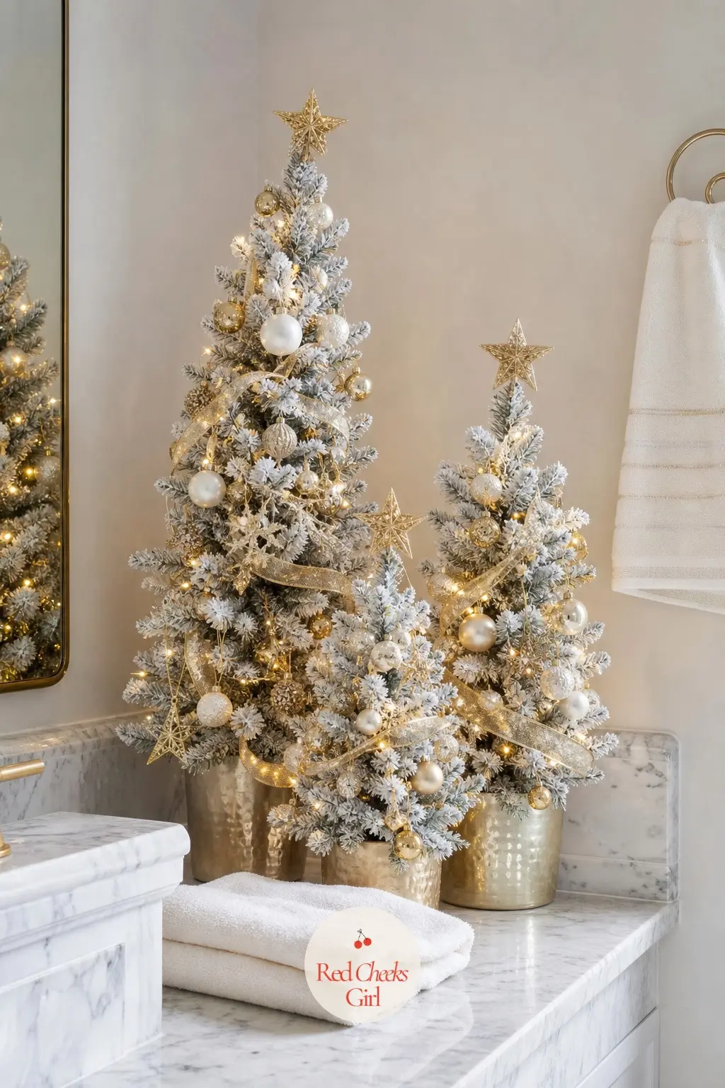 A Cluster of Three Graduated Flocked Mini Trees Anchoring One Corner of the Counter — Three mini trees in three heights, flocked white and finished with a