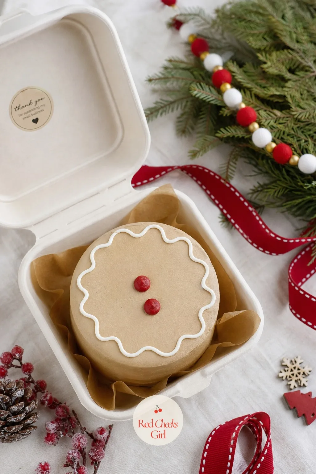 Gingerbread Man Bento — A face is friendlier than a full figure, which is why this one stays at the cake's edge instead of trying to be a whole gingerbread man