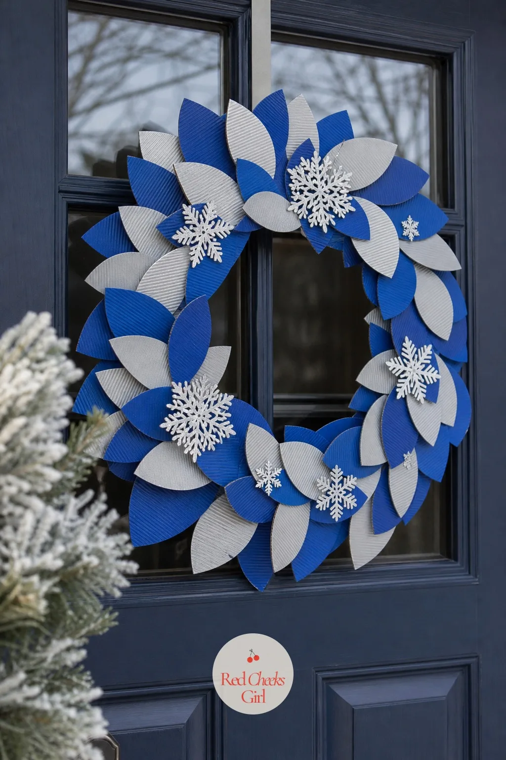 The Layered Cardboard Wreath — A real wreath dries out and drops needles on the porch within the week, right where everyone steps. Christmas cardboard crafts