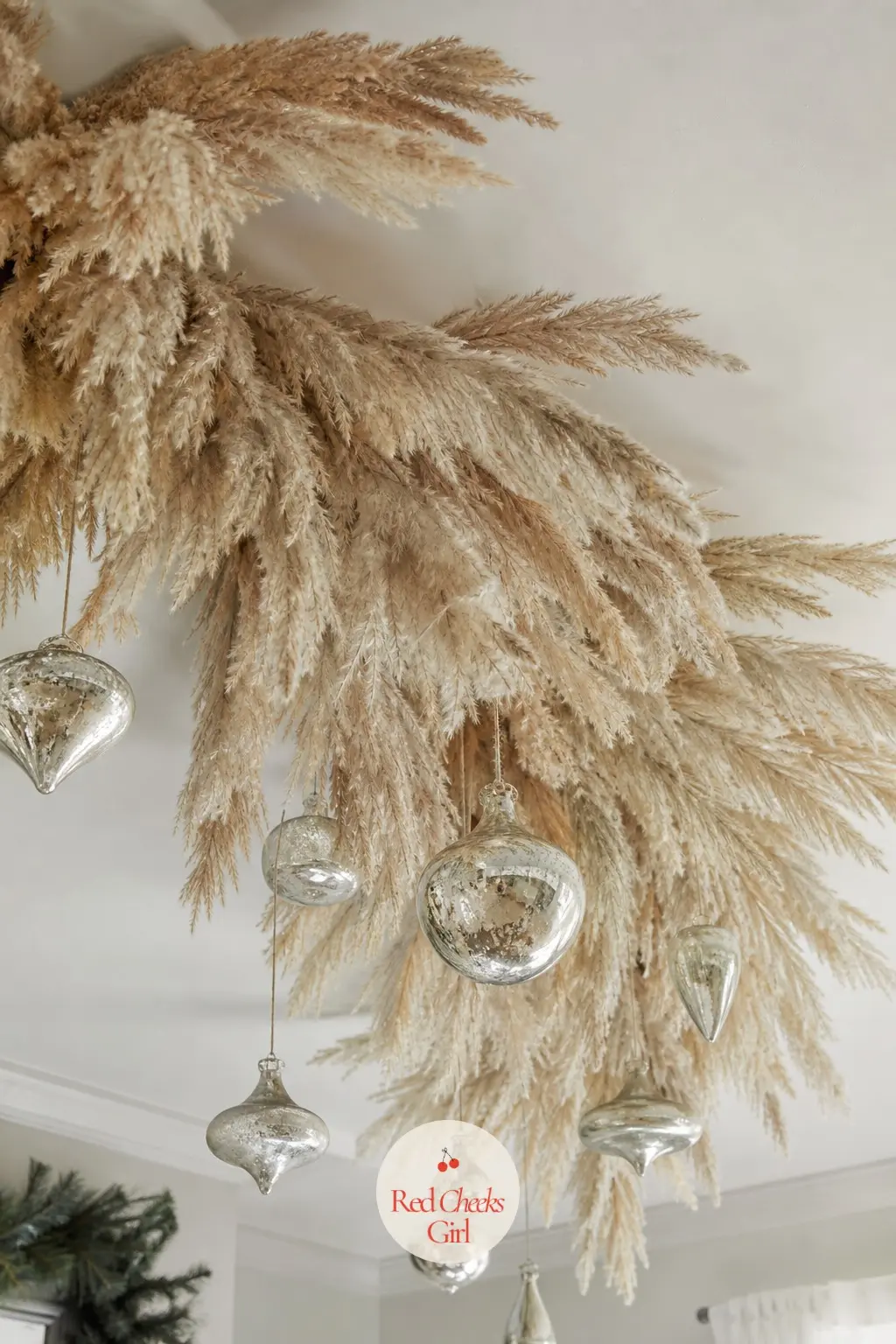 A Canopy of Dried Pampas Plumes and Mercury Glass Drops Over the Dining Table — Wire a loose crescent of dried pampas grass to garden wire, then suspend it