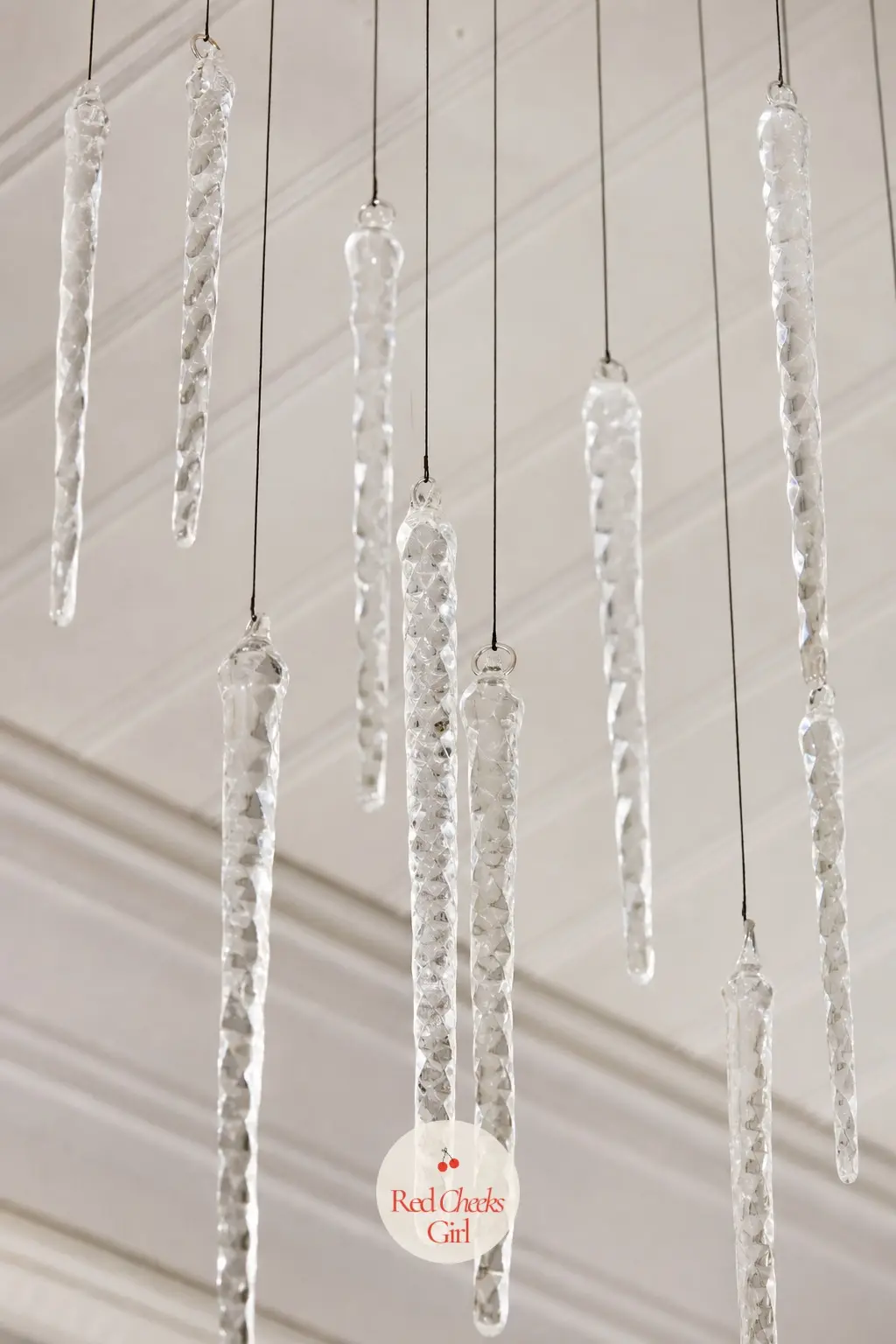 A Curtain of Hammered Glass Icicles on Black Thread Hung Above the Drinks Table — Space thirty or so hammered glass icicles along three parallel lengths of