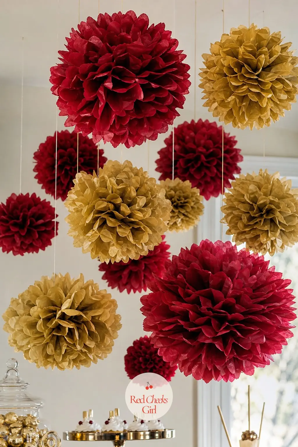 A Drift of Tissue Paper Poms in Ruby and Gold Suspended on Fishing Line Above the Dessert Table — Make a dozen tissue paper poms in ruby and gold, no two the