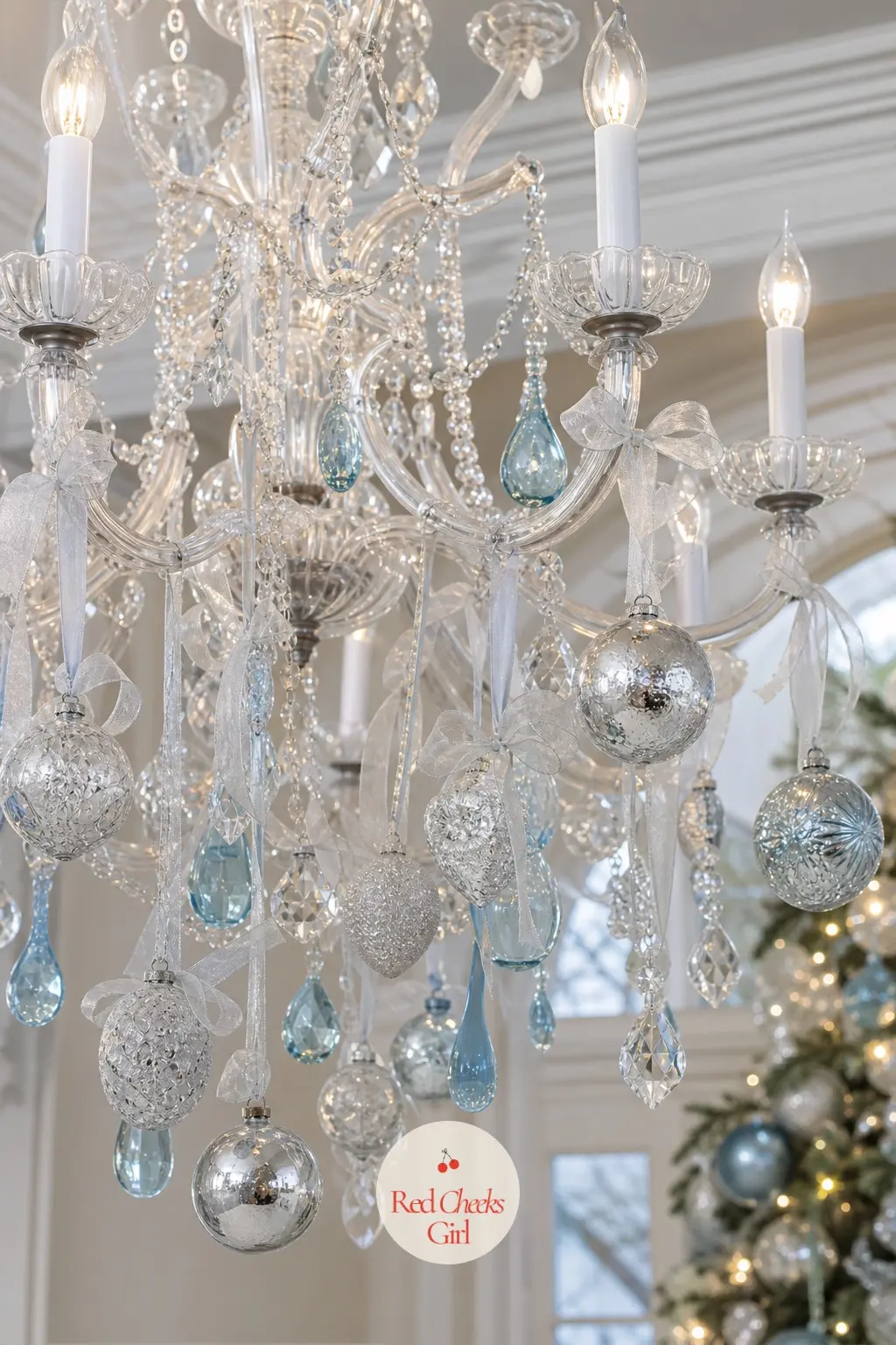 Frosted Silver and Ice Blue Crystal Chandelier — An entryway chandelier is the first thing a guest looks up at, so keep this one cool rather than cosy.
