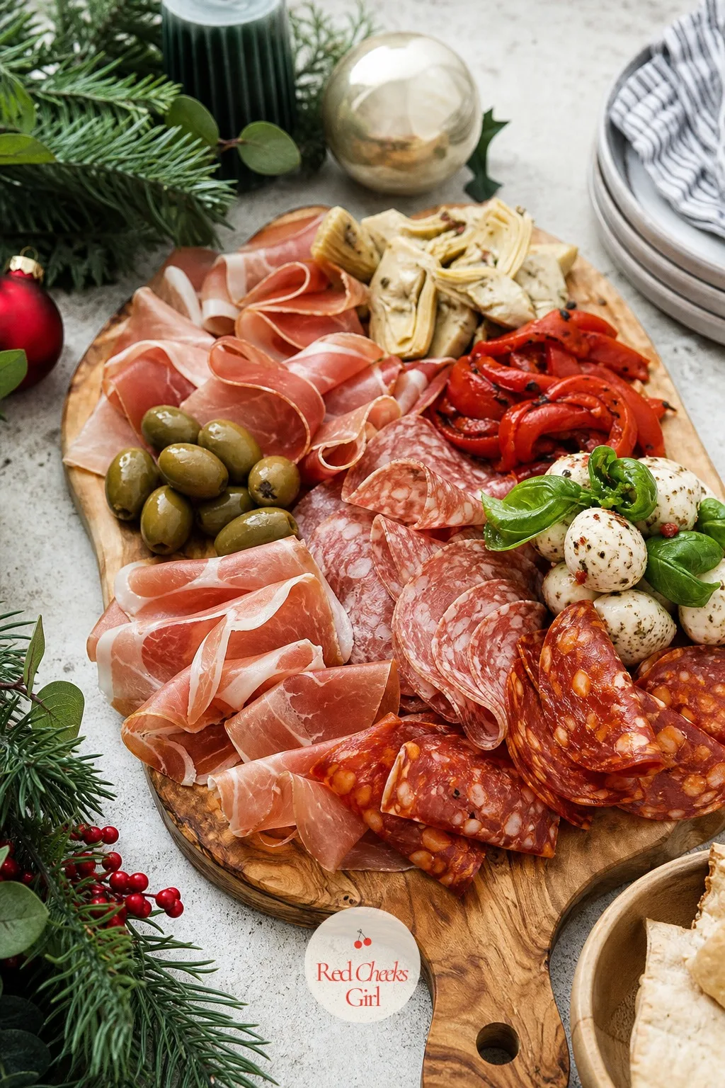 Italian Antipasto Board — This is the board for the guest who finds sweet jam on a cheese plate a bit much and would rather have olives and heat. Christmas
