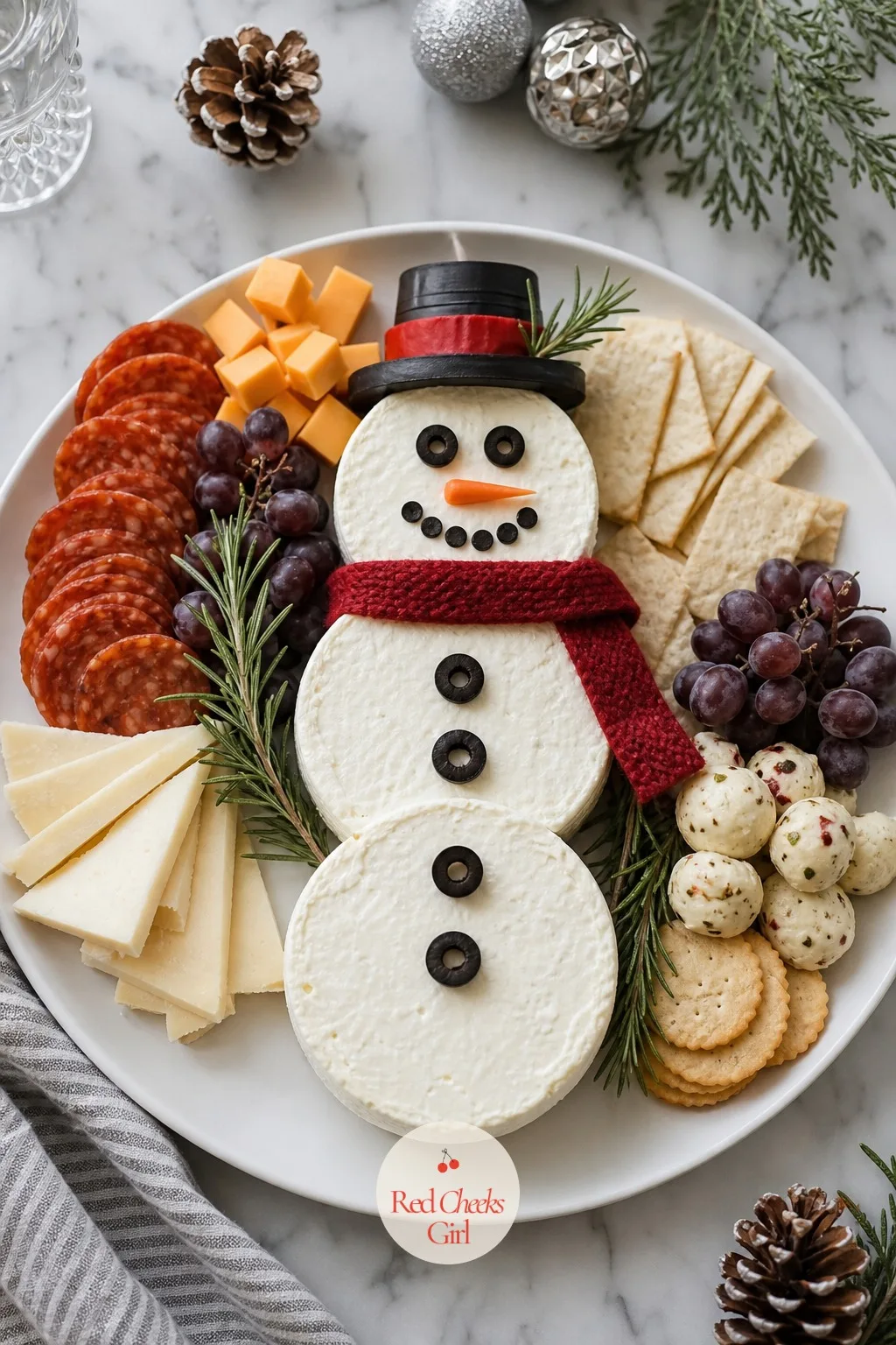 Snowman Board — Three cheese wheels, stacked smallest at top, is genuinely all this one requires, and it gets a laugh every single time it lands on a table.