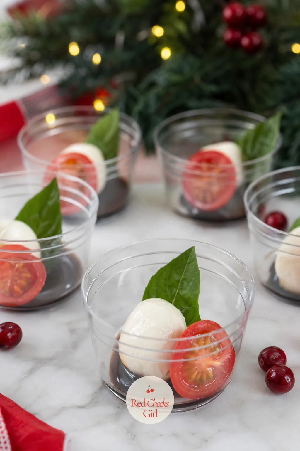 Caprese Cup — This one looks like summer dressed for winter, and that is exactly the relief it offers on a table otherwise full of cured meat. Christmas