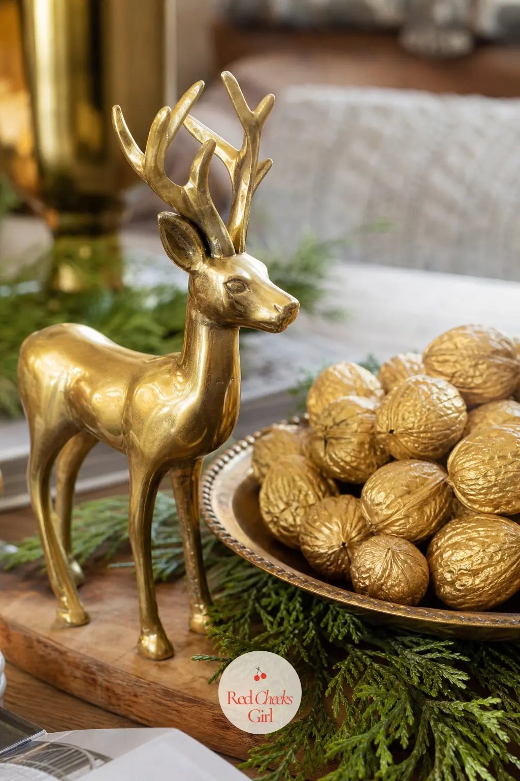 A Brass Stag Figurine Beside a Dish of Gilded Walnuts — A small solid brass stag stands beside a shallow dish of walnuts painted gold, the metal and the