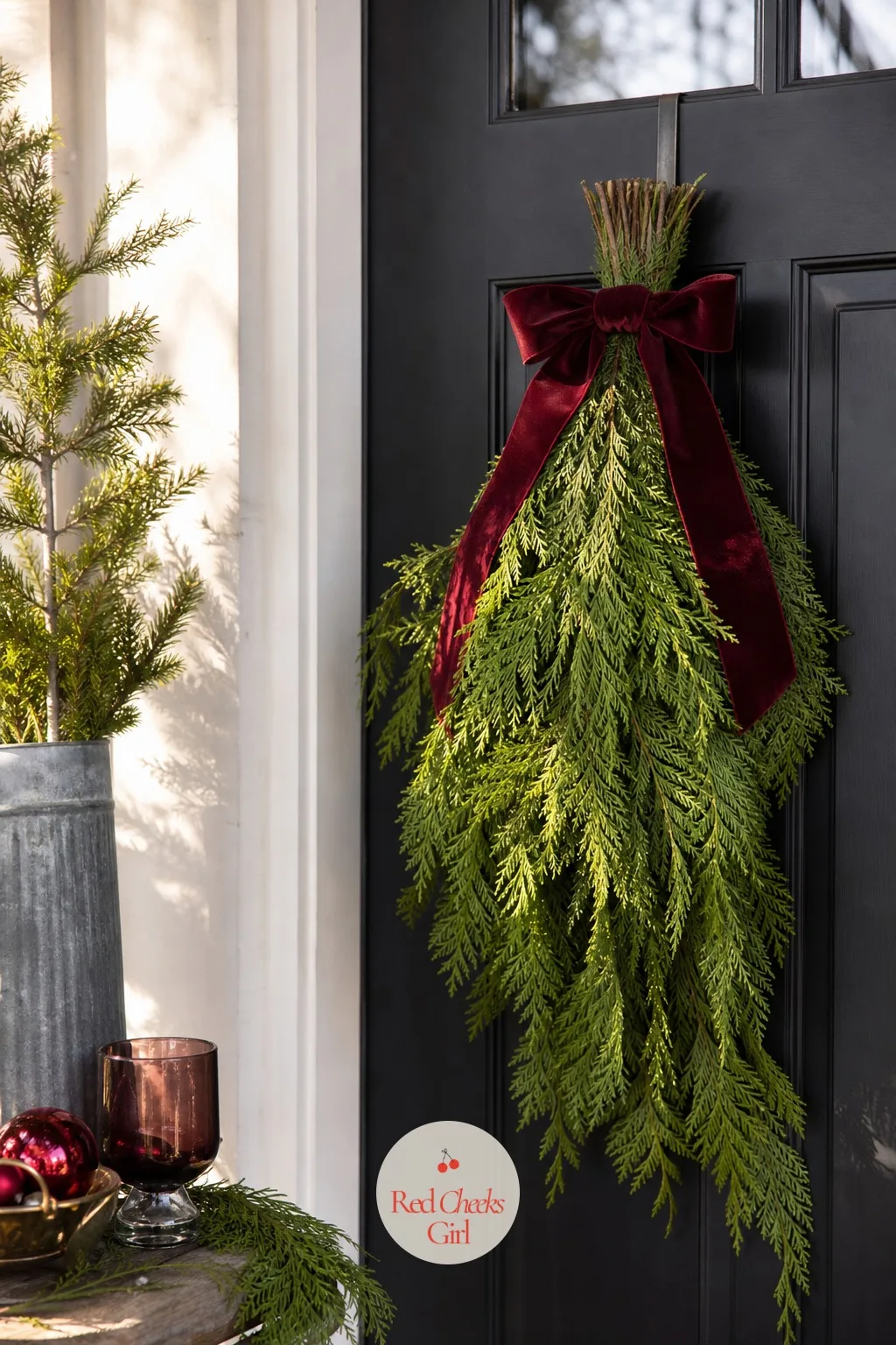 Fresh Cedar Door Swag — Fresh greenery smells like the season in a way nothing artificial quite manages, and a swag is faster to build than a full wreath.