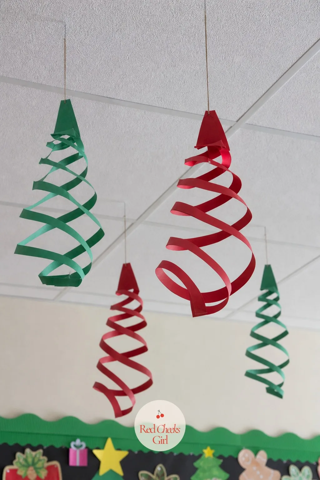 Spiral-Cut Paper Ornaments — Cutting a spiral out of a paper circle takes under a minute and the result twirls on its own the second a classroom door opens