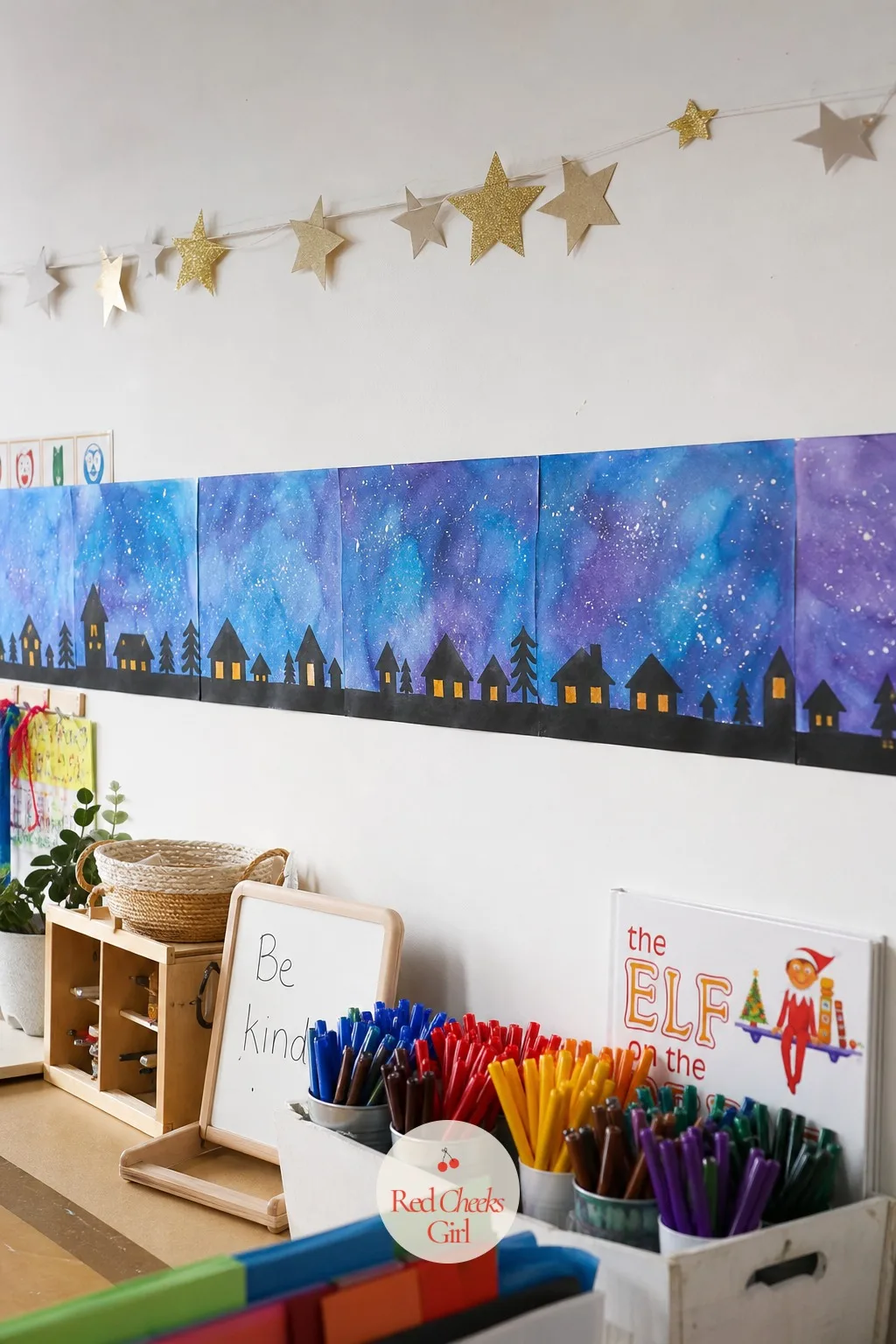Watercolour Winter Skyline Mural Strip — Twenty-six separate paintings pinned at random look like a bulletin board. Christmas crafts for kids at school