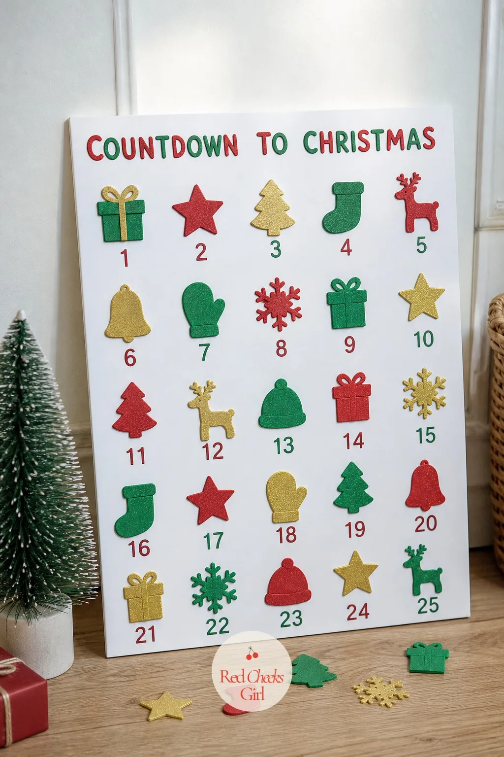 Foam Sticker Countdown Poster — A grid drawn on a sheet of poster board, filled one square at a time with foam stickers in red, green and gold, gives a toddler