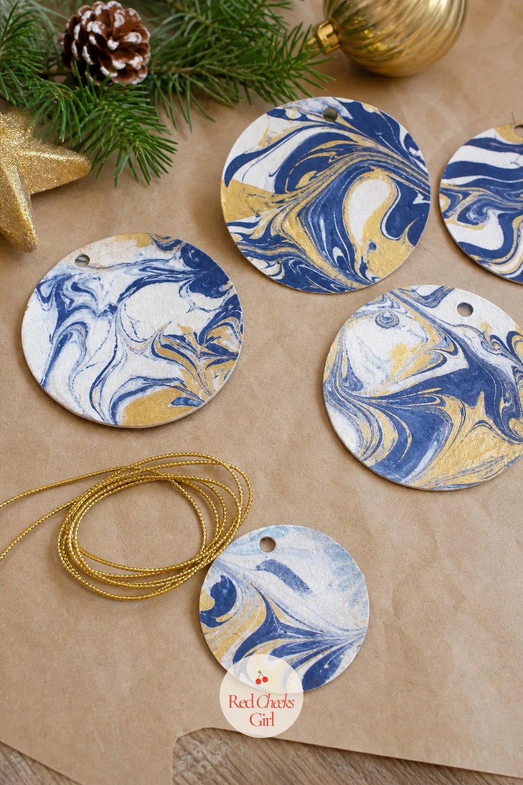Marbled Shaving Cream Ornaments — A tray of shaving cream swirled with a few drops of navy and gold liquid colour, then a cardstock circle pressed on top and