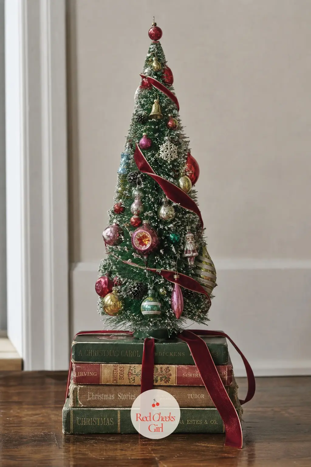 A Stack of Vintage Christmas Books Topped with a Bottlebrush Tree — Stack four or five old hardcover books with worn, faded spines and sit a single forest